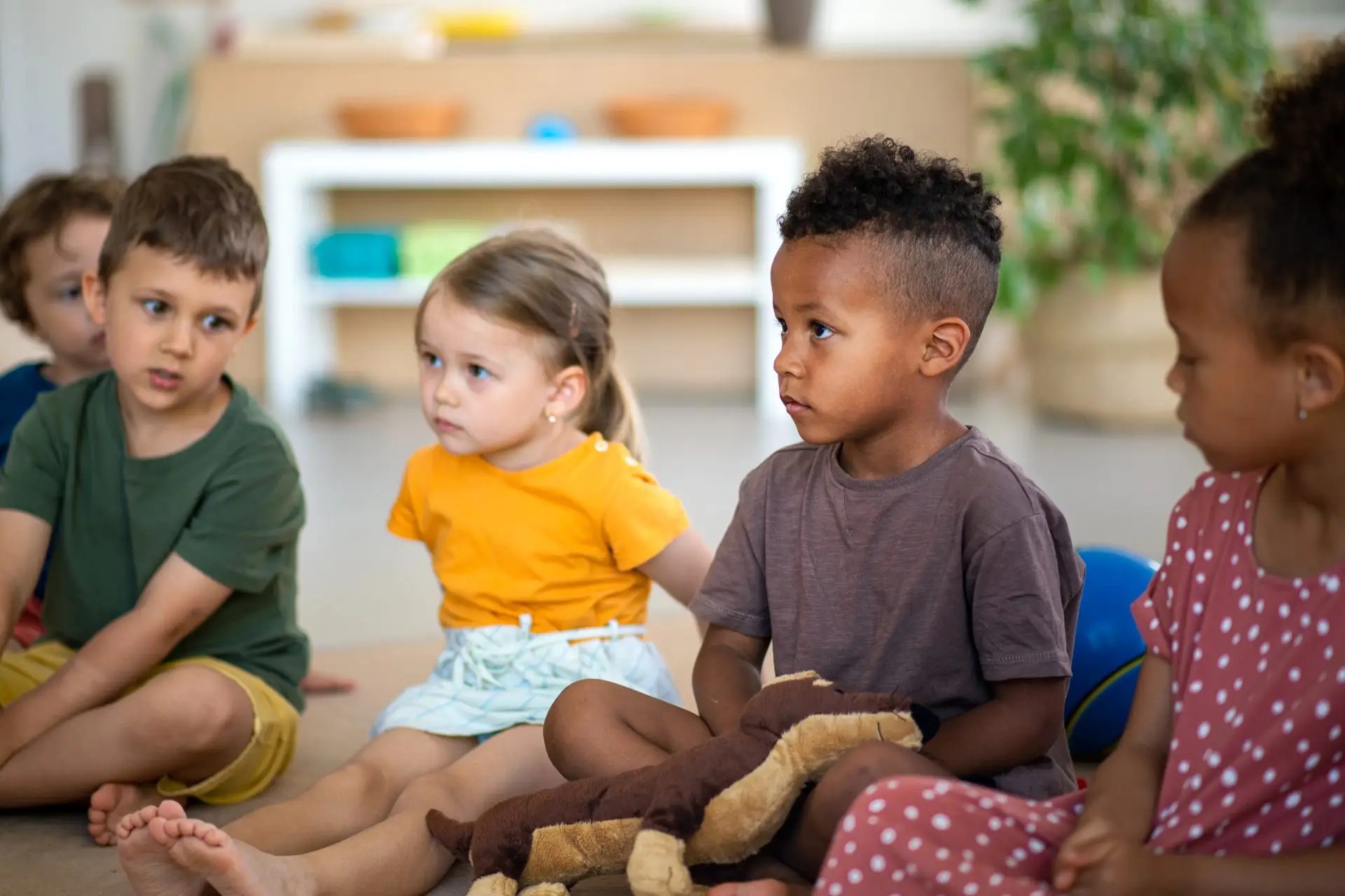 Group of nursery children sitting together at circle time Nursery Rhymes Broughty Ferry
